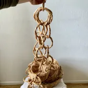 Large wicker suspension with three baskets, twisted ring chain.