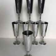 Set of eight silver metal flutes