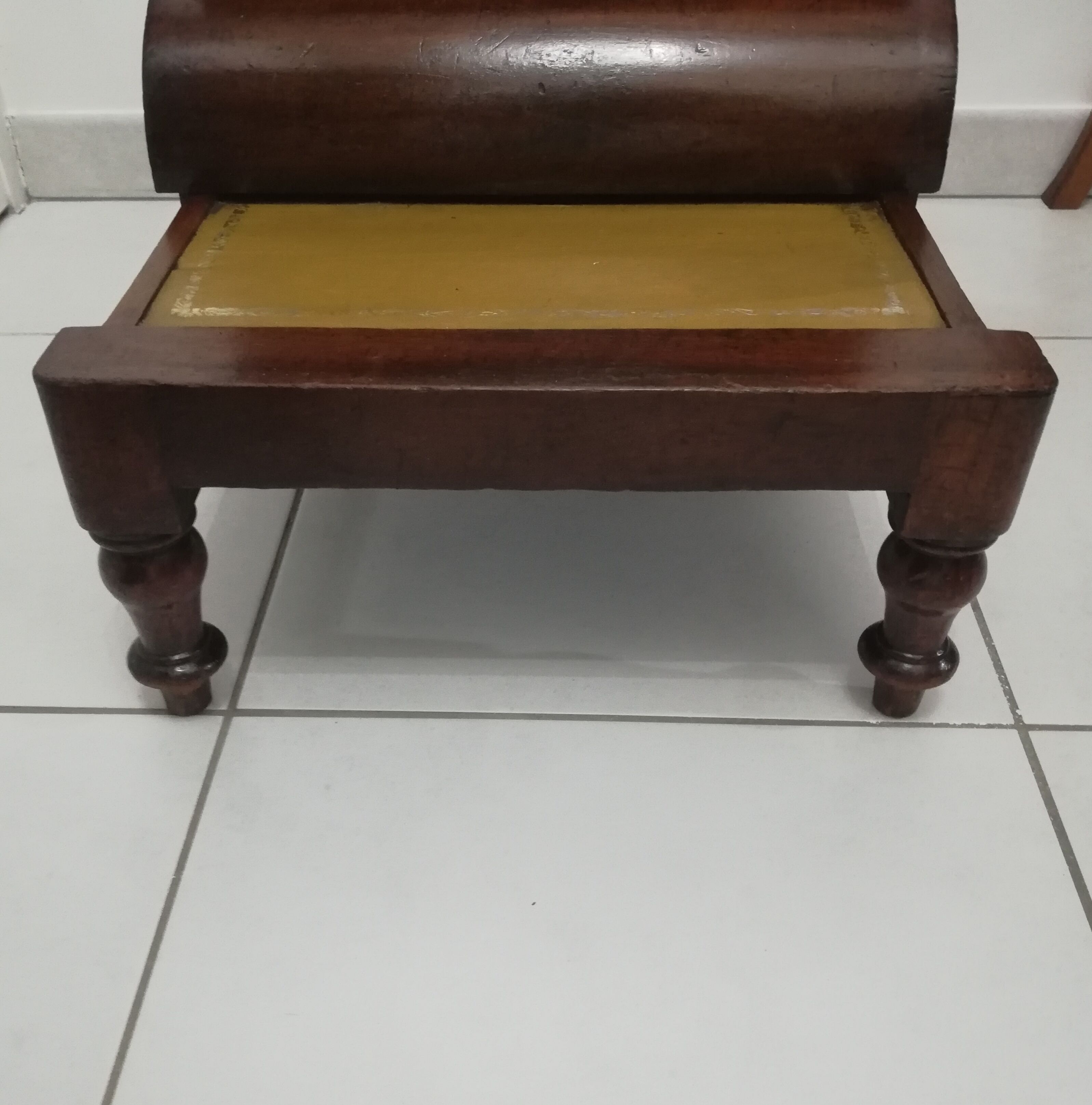 Old stepladder or English mahogany library foot walk