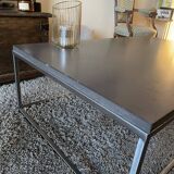 Coffee table in stone and brushed steel