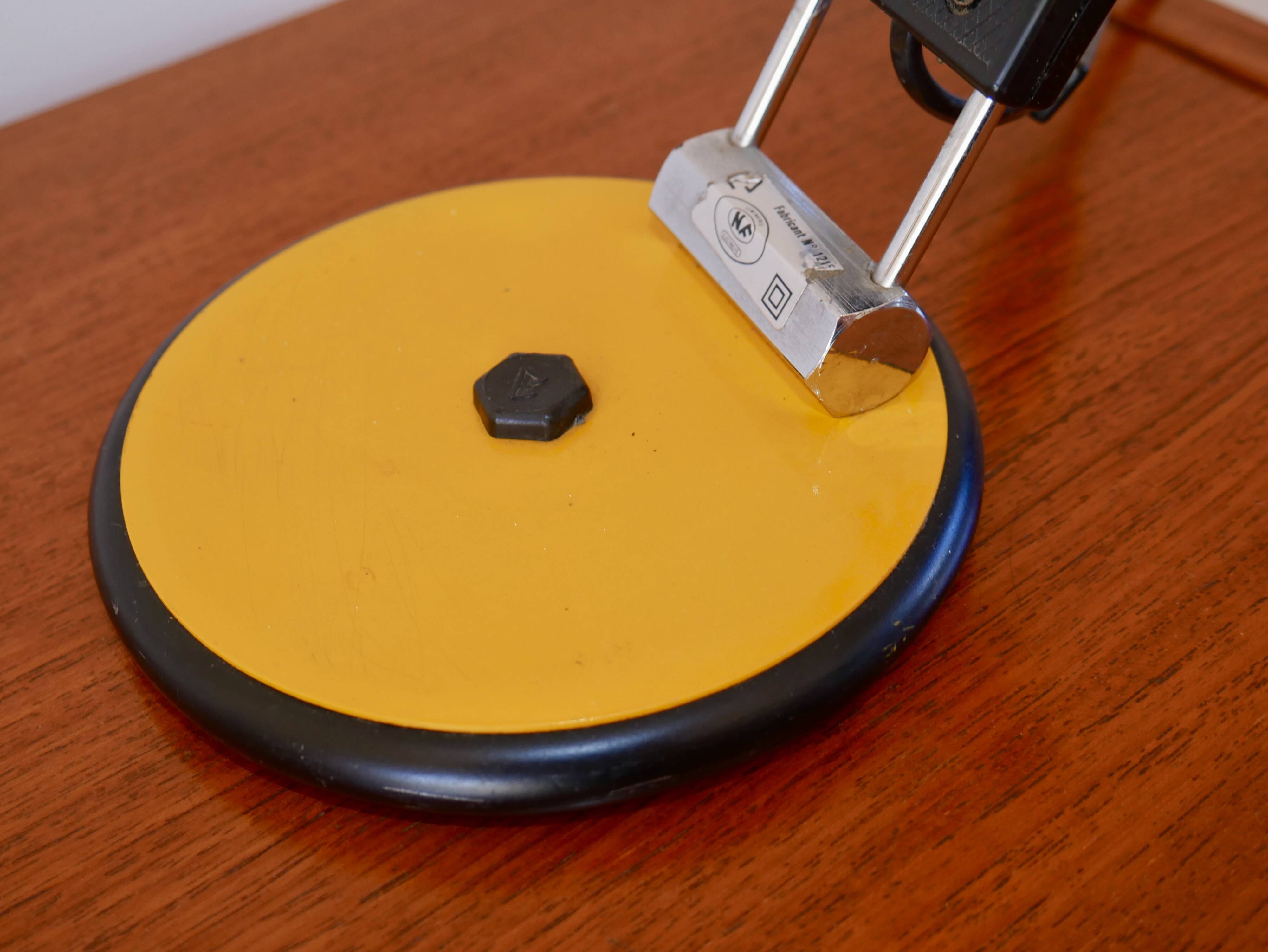 Articulated orange Aluminor desk lamp industrial design 70s
