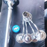 Standing candlestick in stainless steel metal with 5 movable branches, with smooth ring for 4 cm candles.