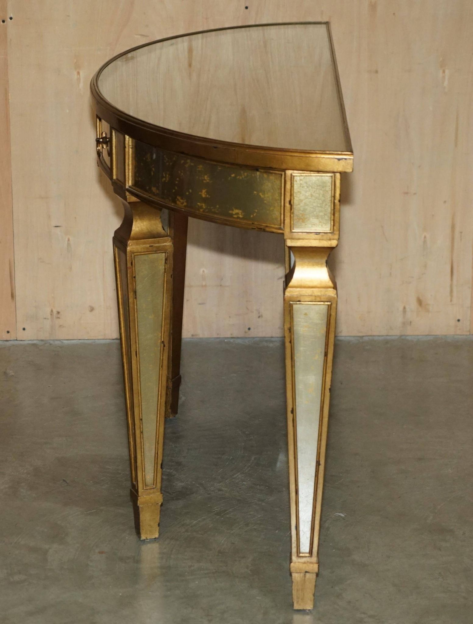 Half-moon console Eglomise Theodore Alexander with a gold finish.