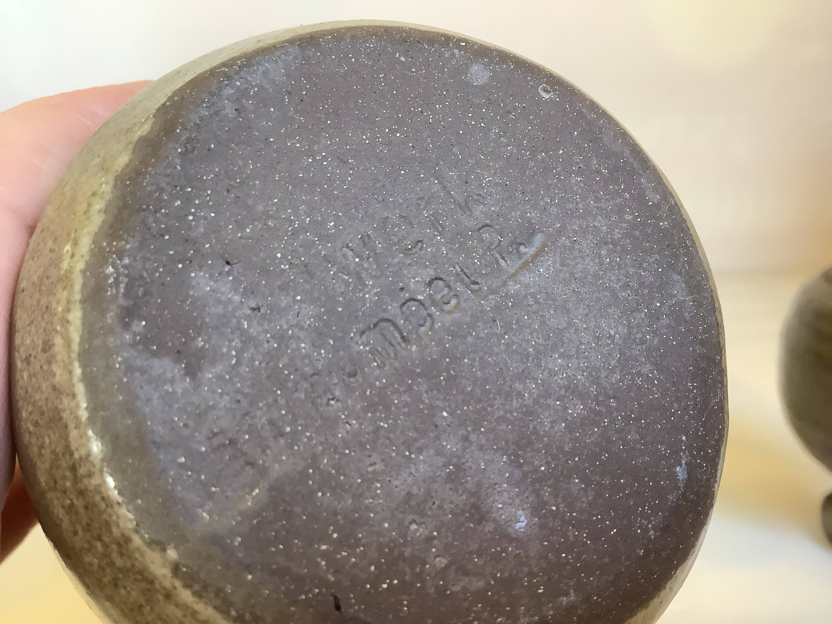 Eight brown ceramic pitcher vases