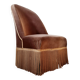 Brown velvet crapaud armchair with fringes and sculpted legs.