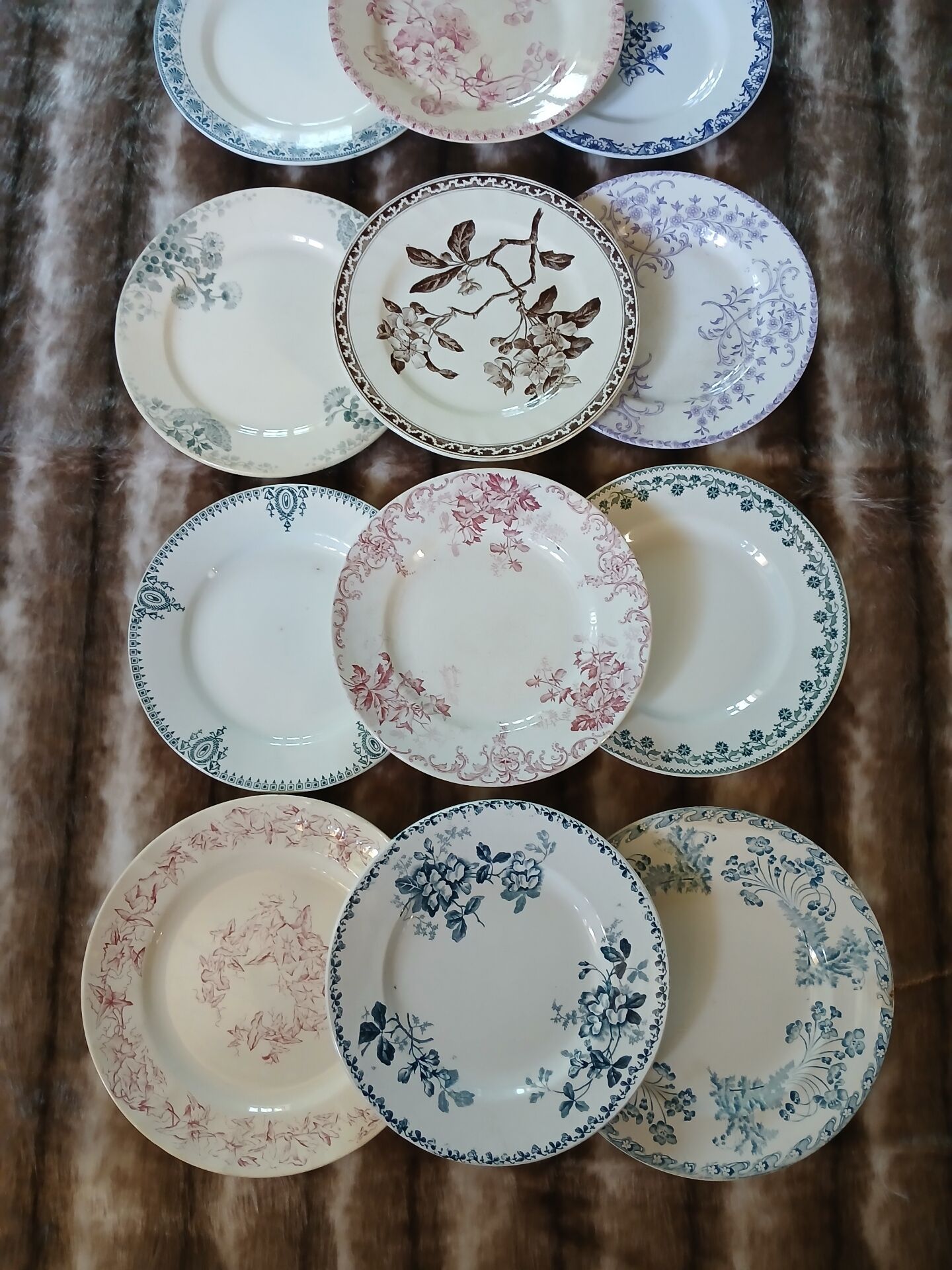 13 mismatched flat plates in ironstone