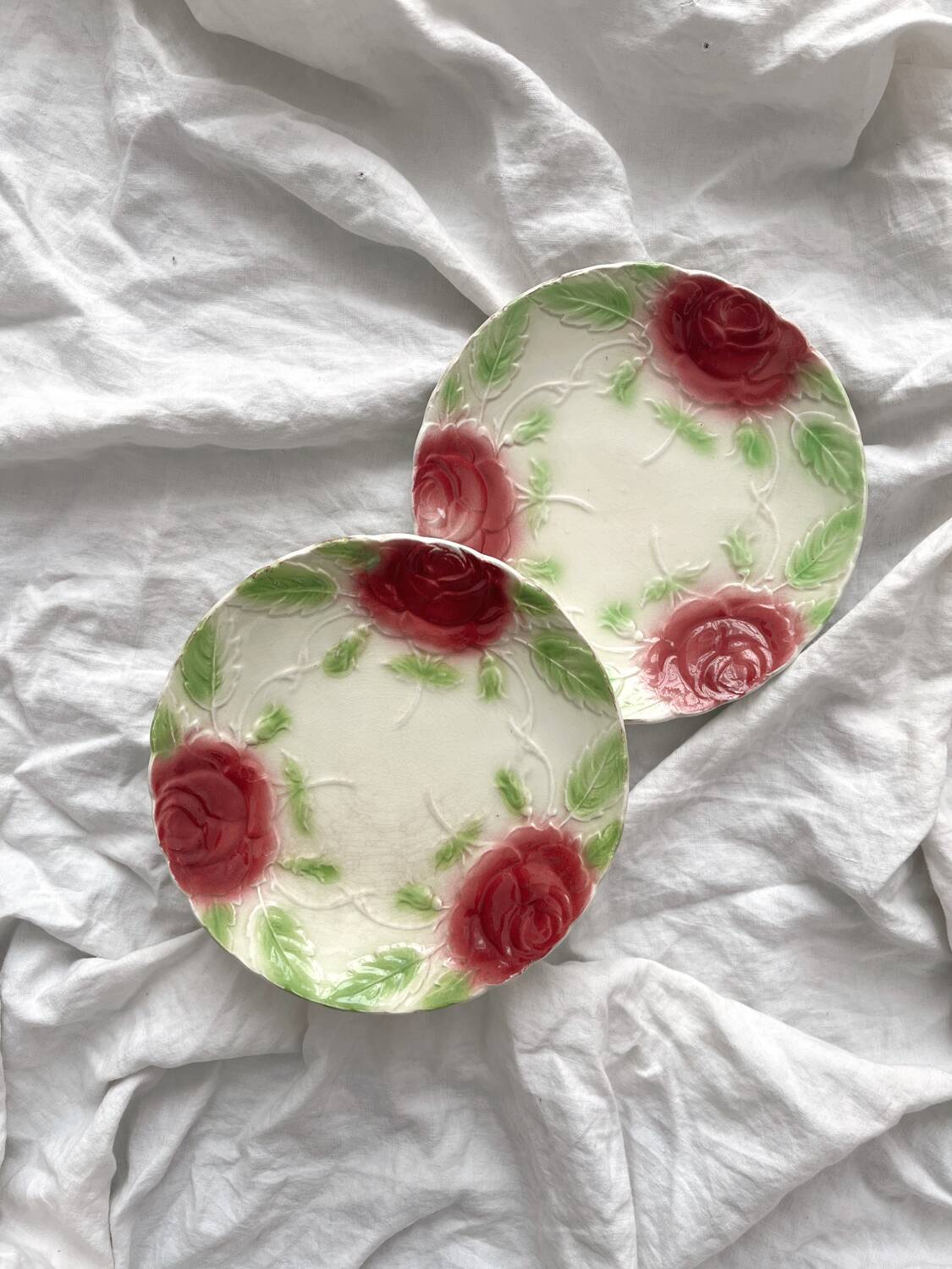 2 old slip plates decorated with roses