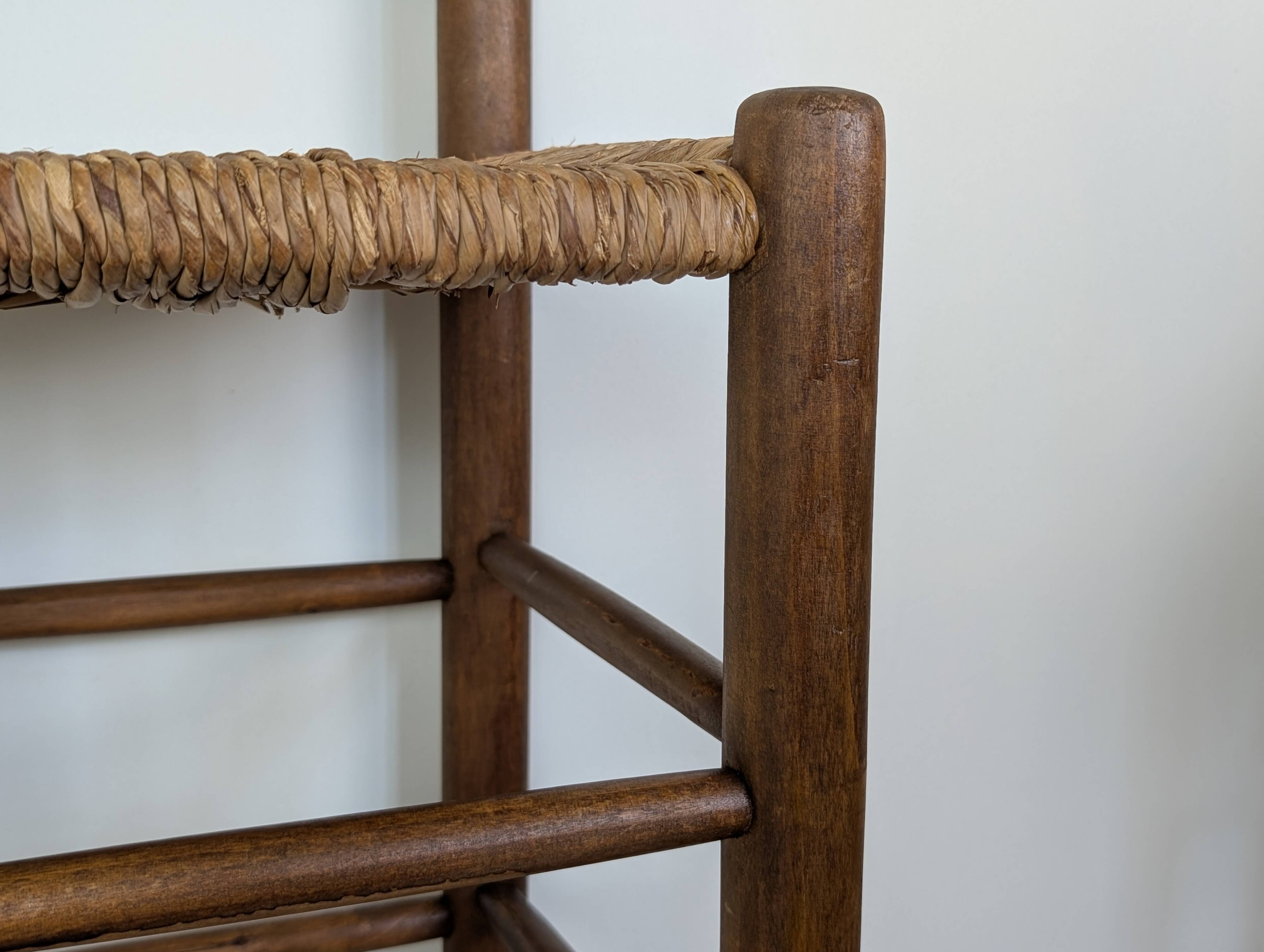 High wooden and straw stools