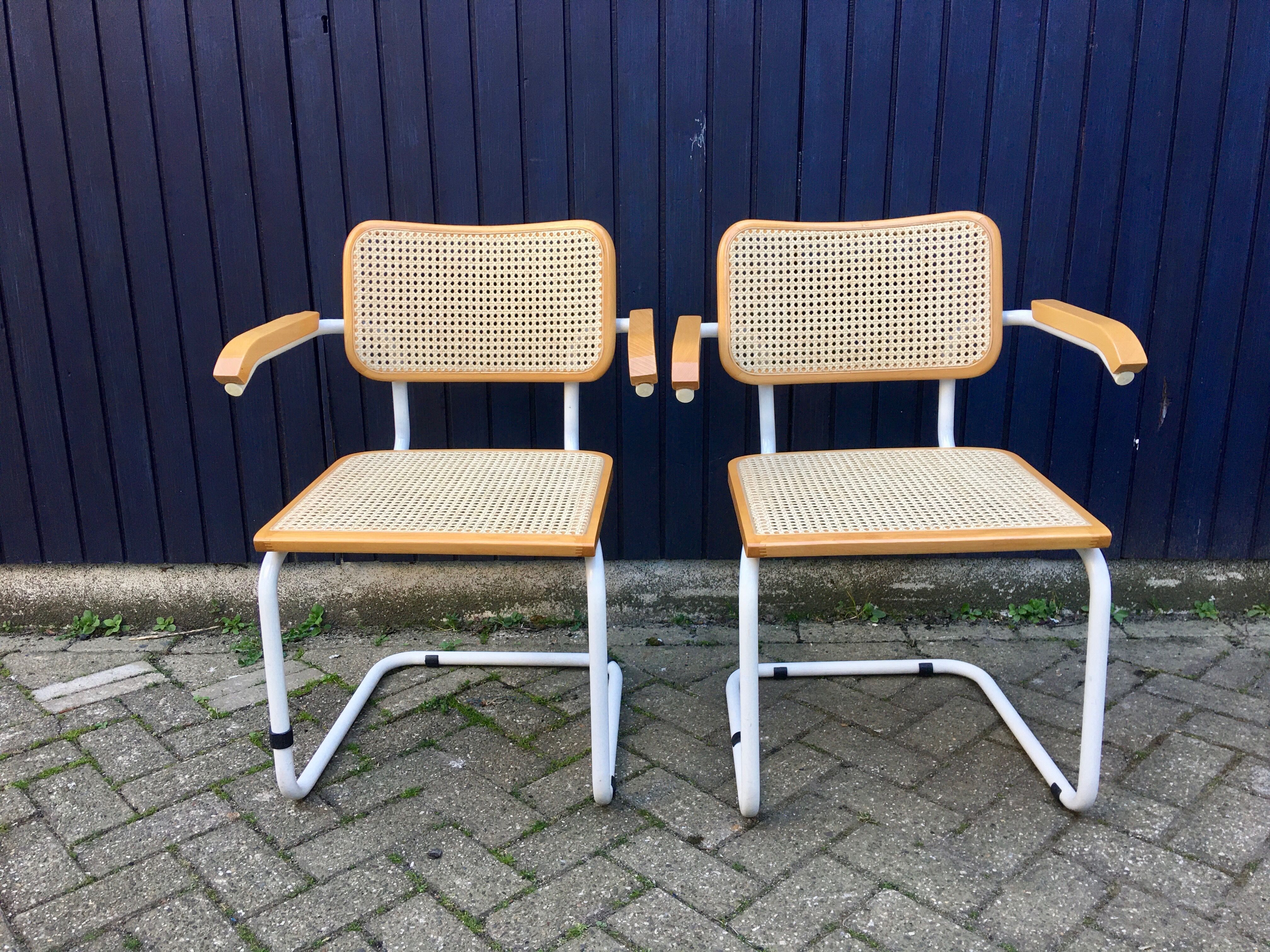 Marcel Breuer's white S64 armchairs