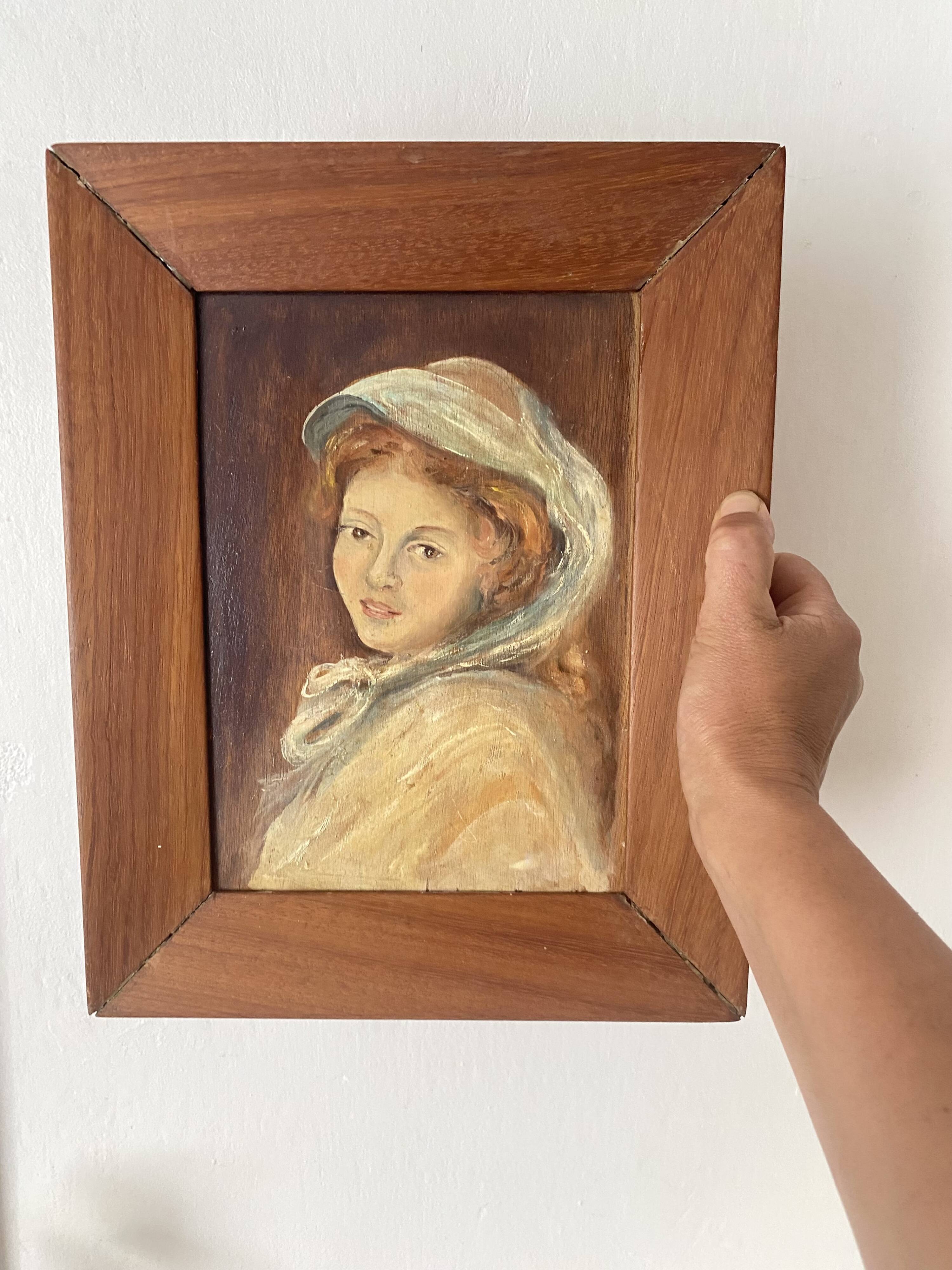 Old oil portrait on wood of a young woman
