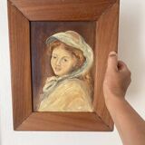 Old oil portrait on wood of a young woman