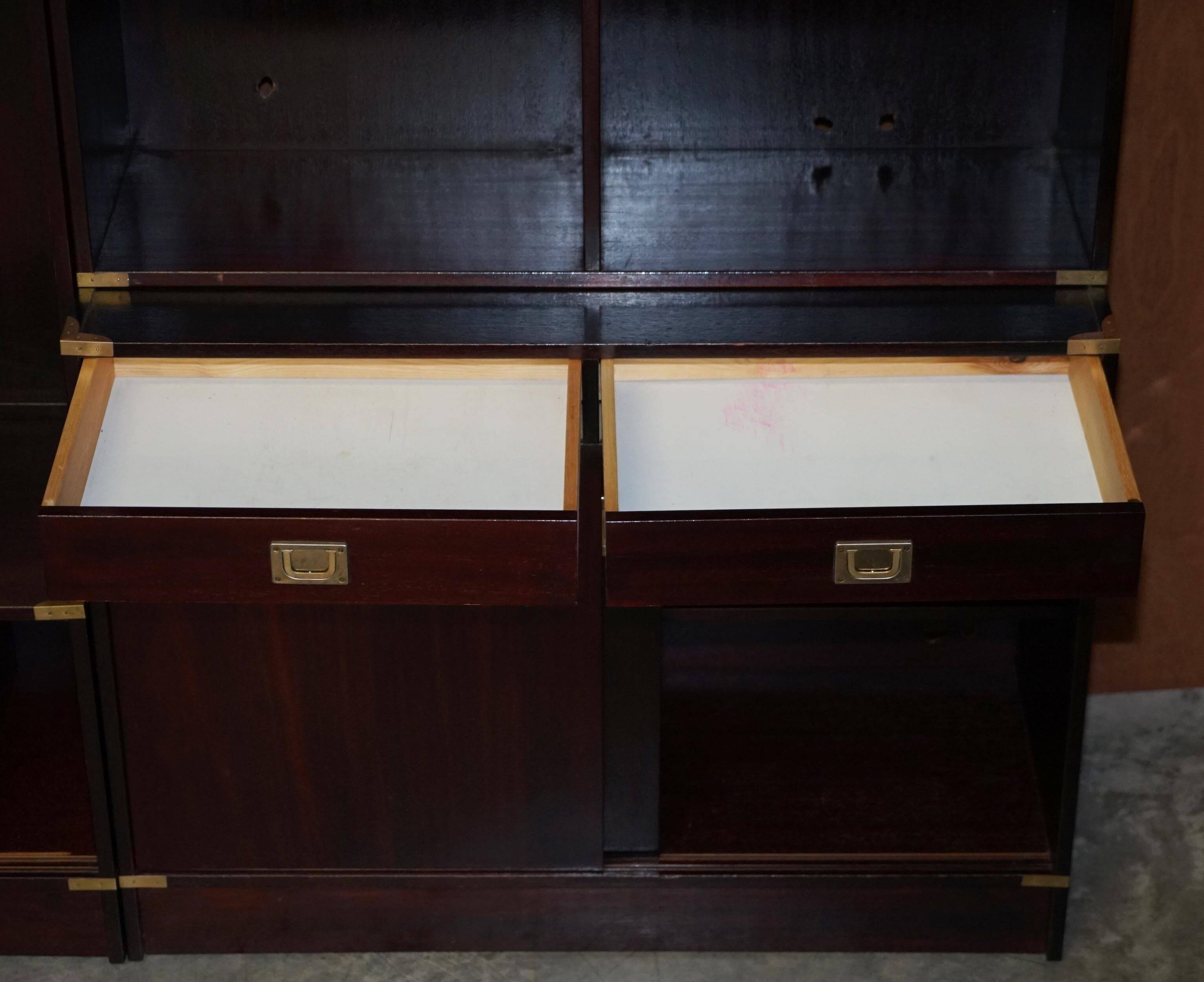 Three vintage style Military Campaign bookshelves, mahogany finish.