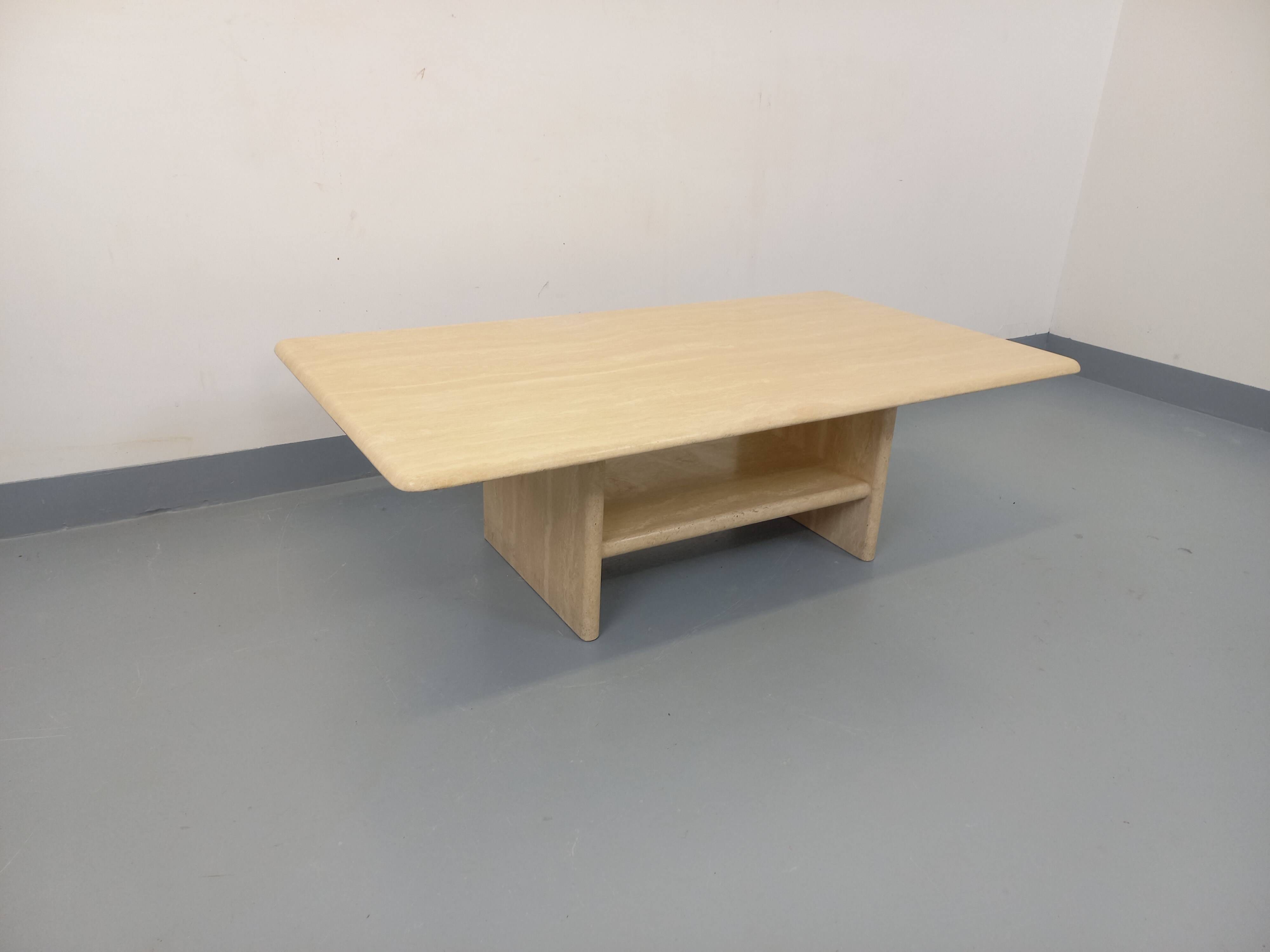 Vintage rectangular coffee table in travertine with magazine rack.