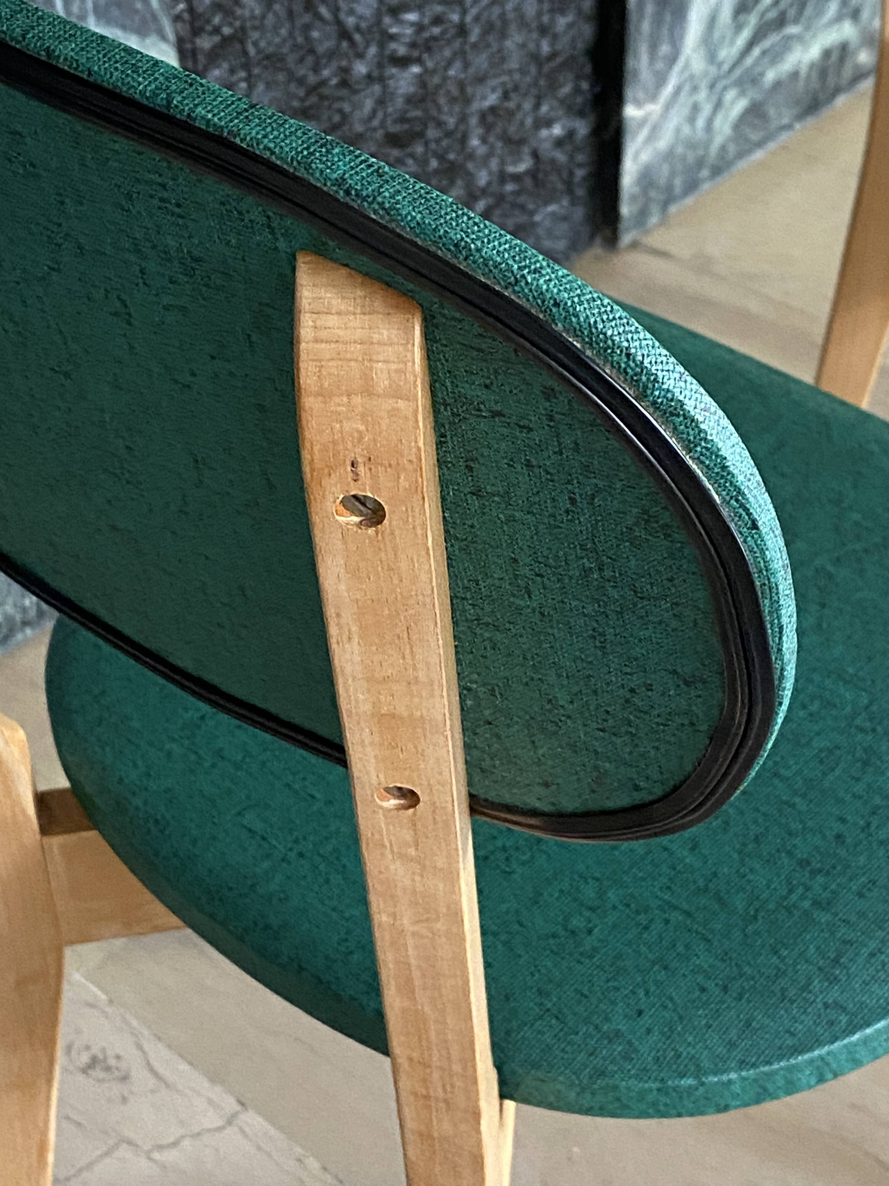 Paire de chaises vintage skaï vert pieds compas