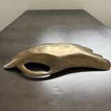 Old brass pocket emptier
