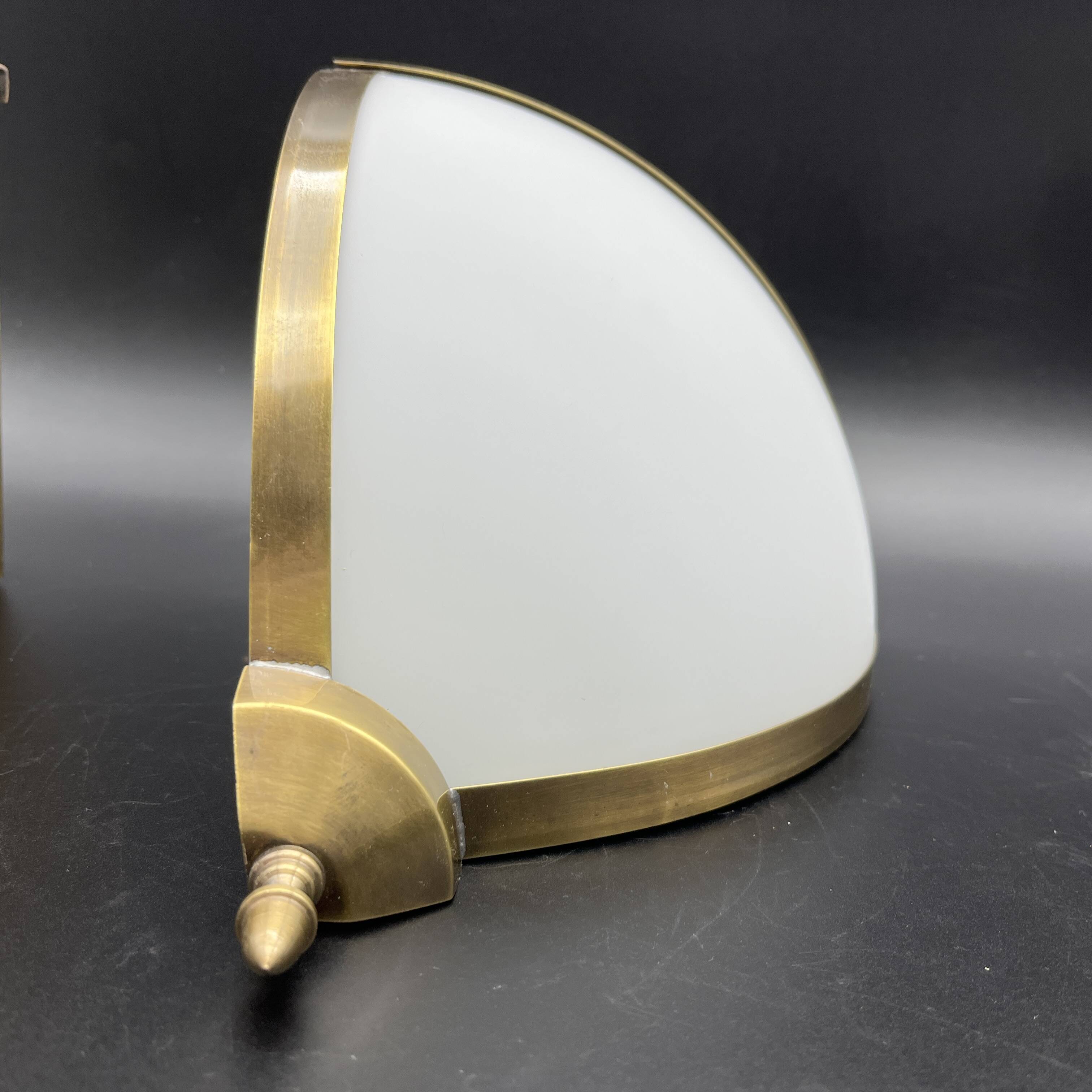 Pair of corner sconces in golden brass and matt opaline
