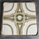 Ceramic tile trivet with vintage pattern woven wicker outline