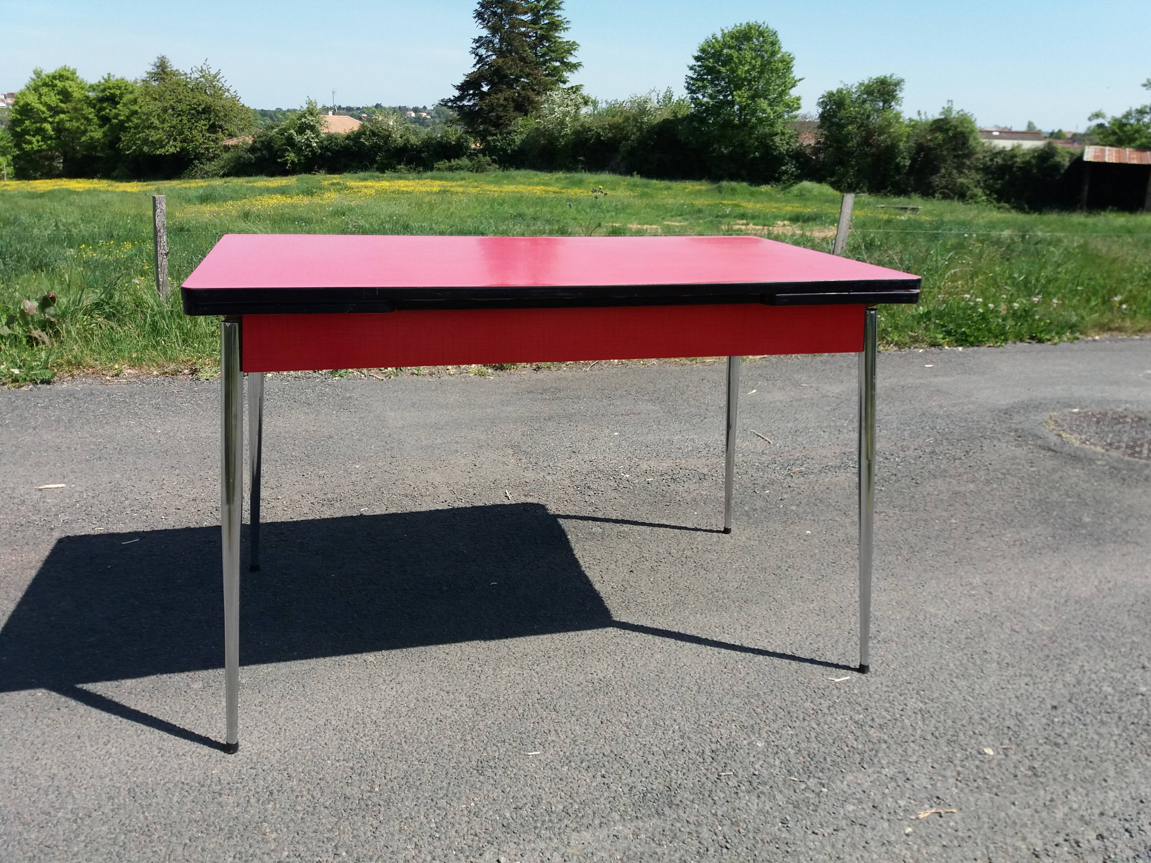 Dining table with red formica extensions