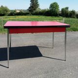 Dining table with red formica extensions