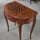 Half-moon gaming table in Louis XV style, made of precious wood marquetry.