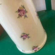 Old flowery and gilded pitcher.