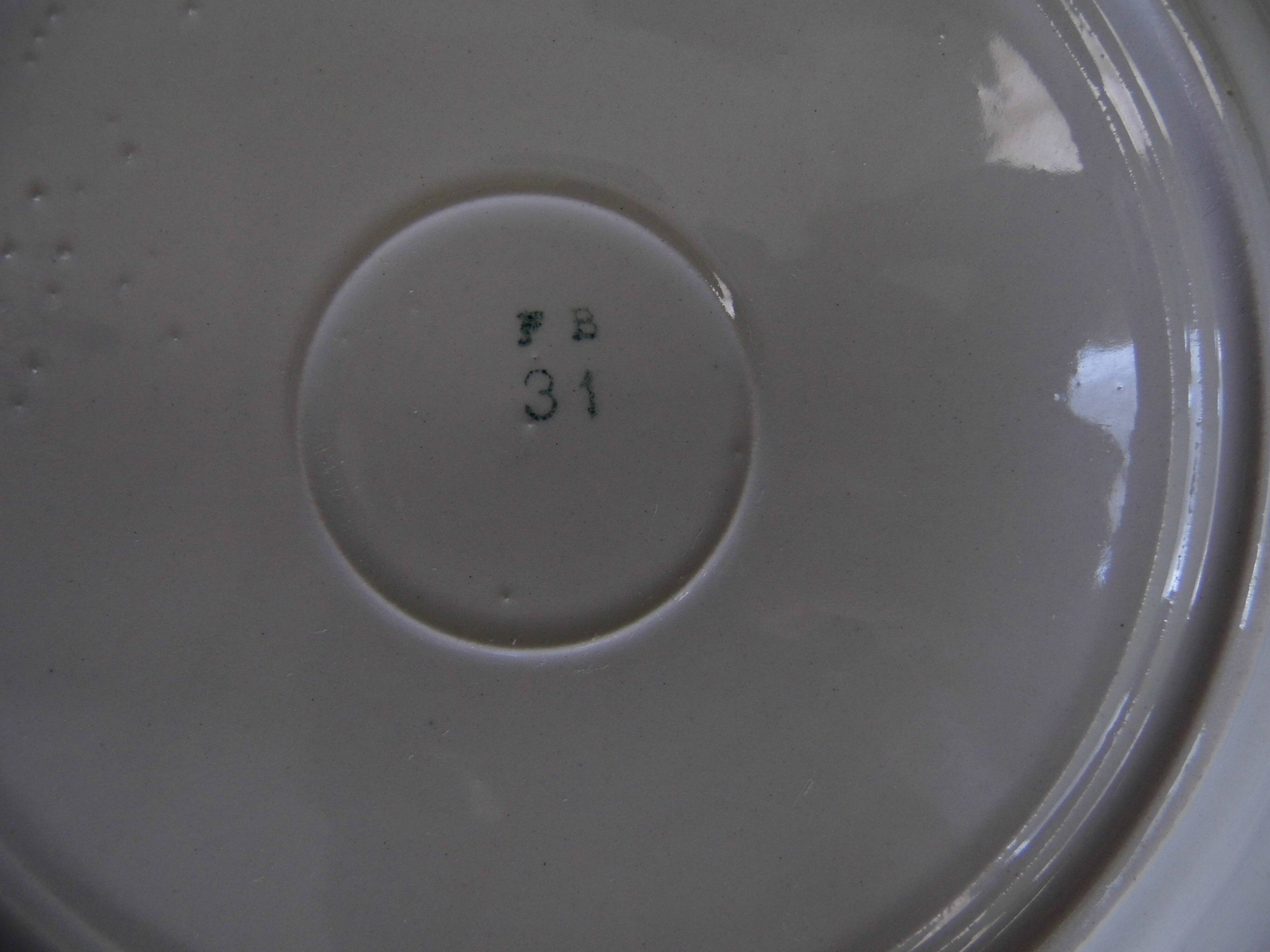 4 plates in faience of Badonviller F.B, floral motif, 20s