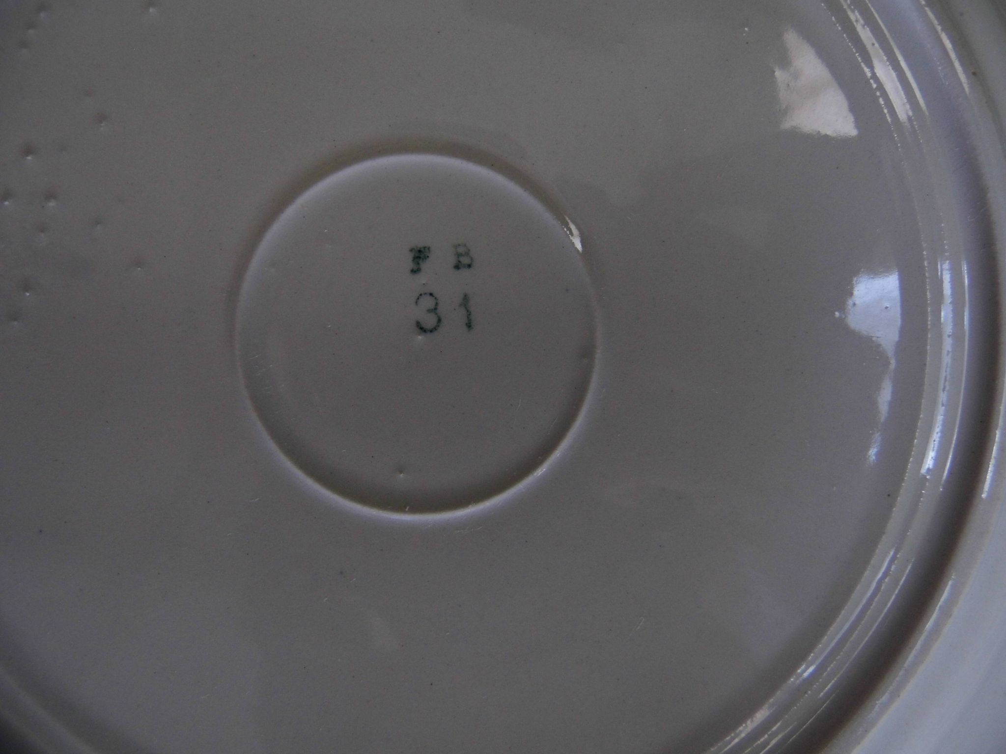 4 plates in faience of Badonviller F.B, floral motif, 20s