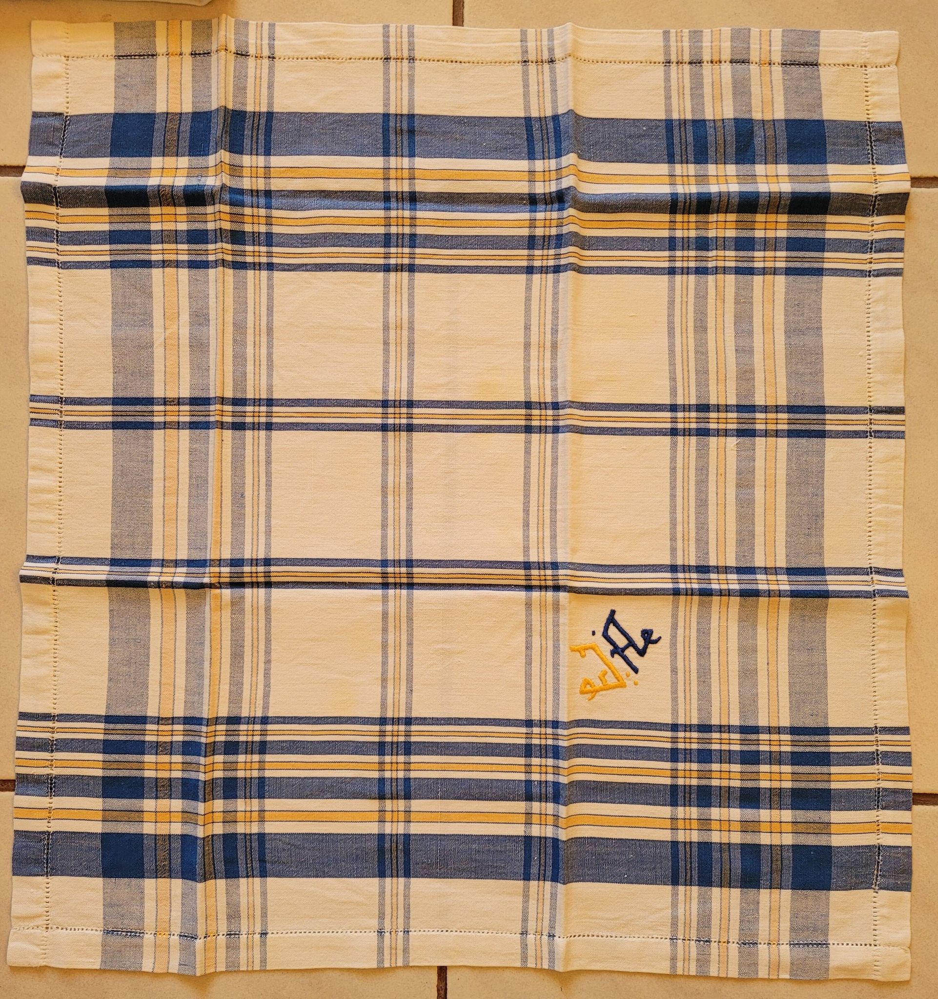 Cotton tablecloth for 12 place settings with napkins.