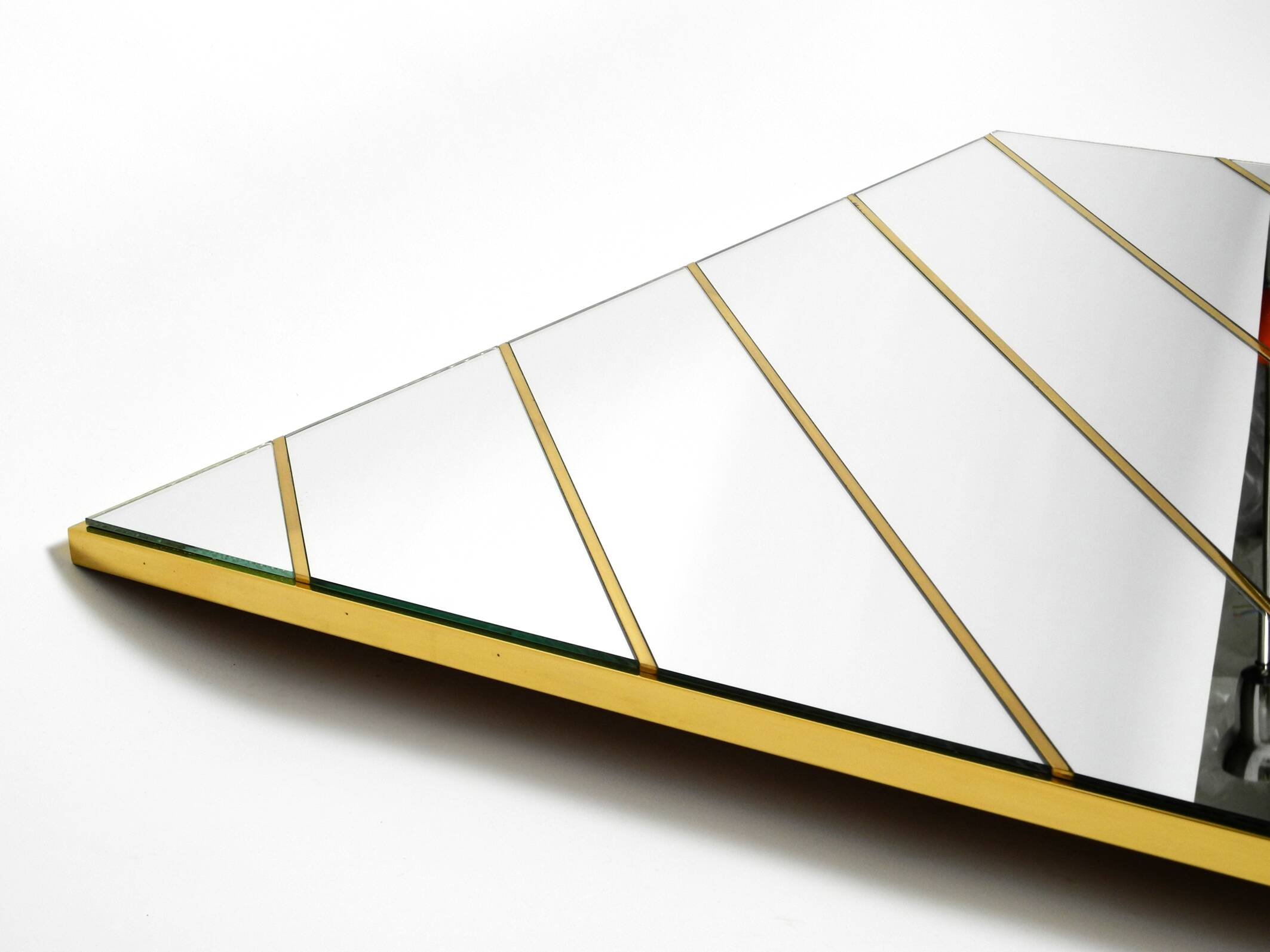 Large, exceptional 1970s brass wall mirror with diagonal mirror strips