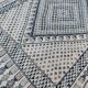 White and blue handwoven rug in natural wool