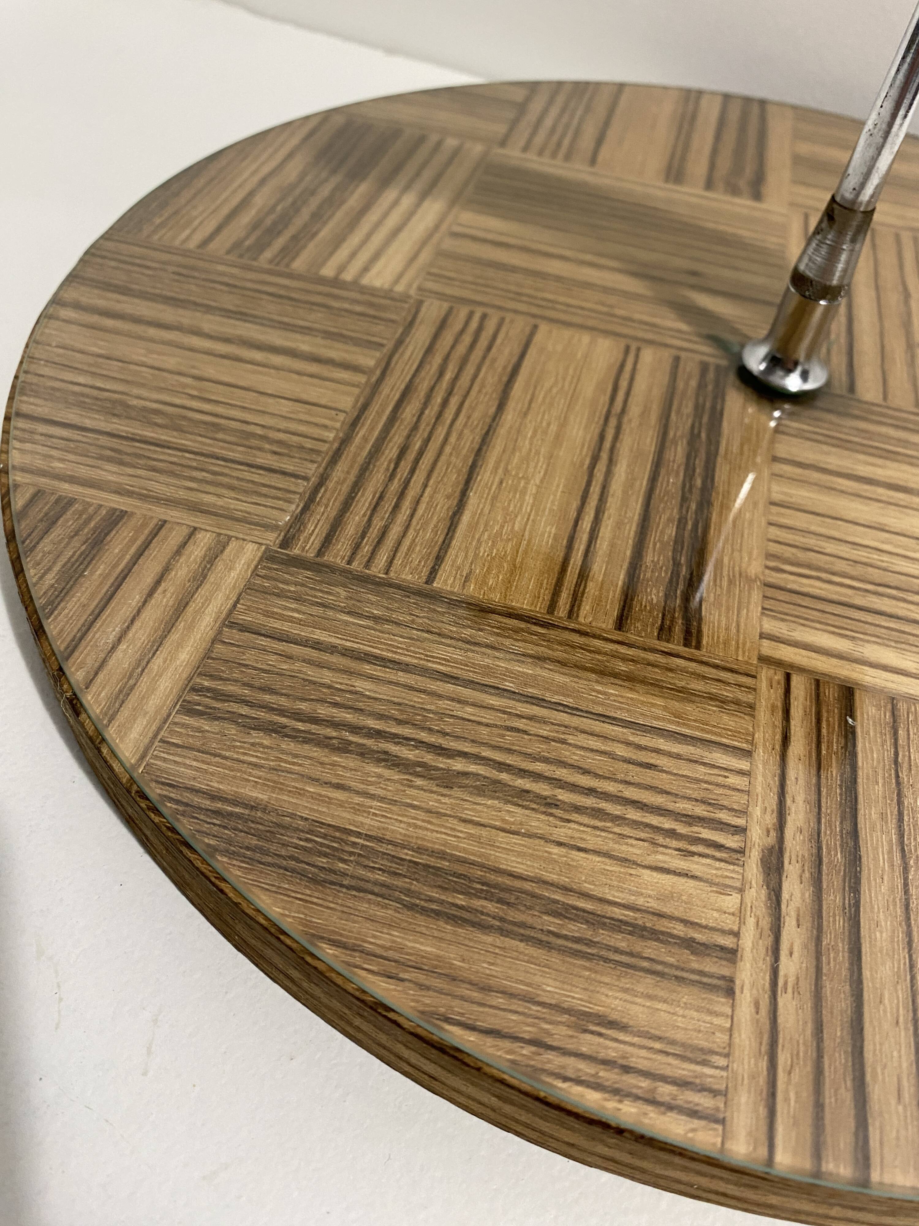 Vintage round wooden cheese board covered with glass plate with foldable handle