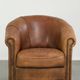 Aged sheepskin clubchair with beautiful vintage patina and comfortable seat
