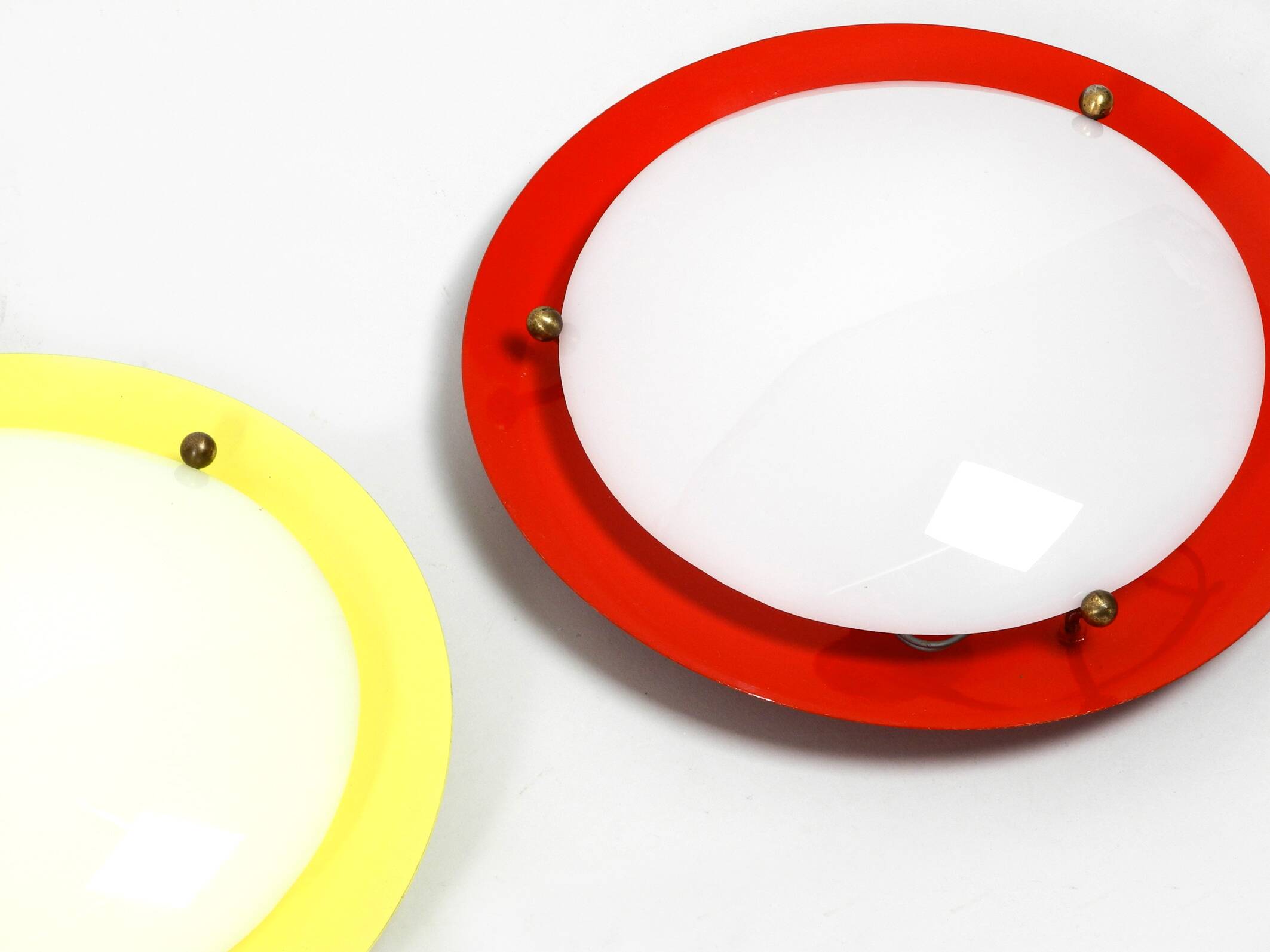 Three round 1950s wall or ceiling lamps made of metal and plexiglass shades