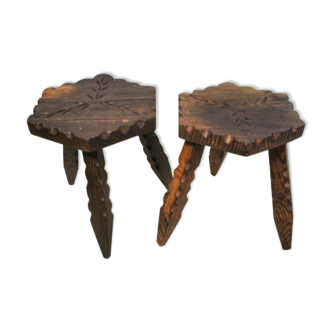 Pair of tripod stools made of carved wood