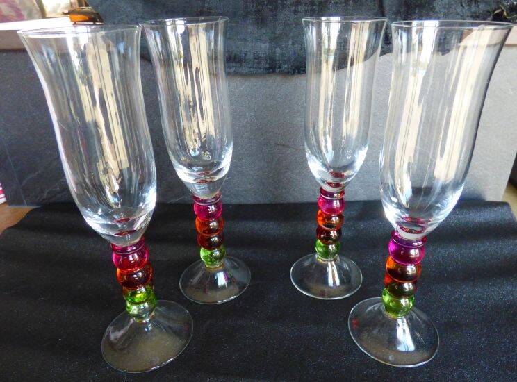 4 vintage flutes with coloured glass stems