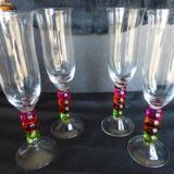 4 vintage flutes with coloured glass stems