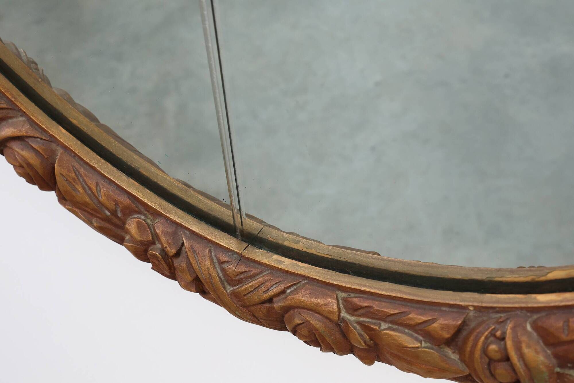 French oval gilded oak  carved art deco mirror, ca. 1925