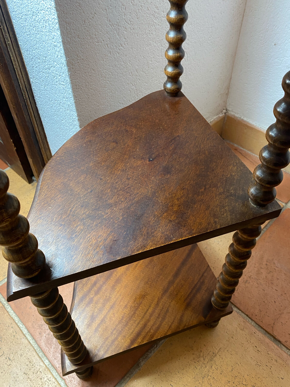 Corner shelf on a turned wooden stand