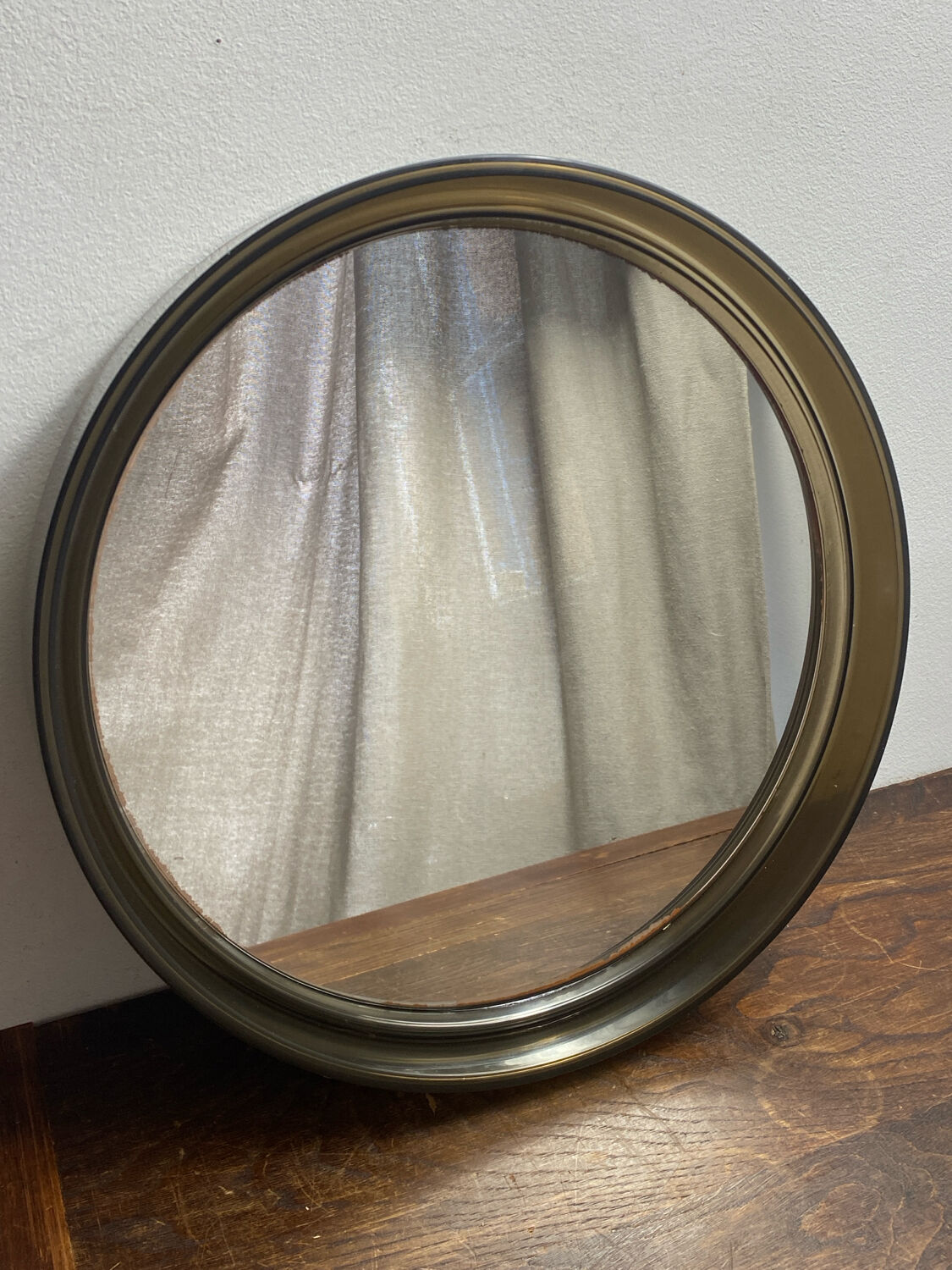Circular mirror, smoked plastic, 1960s/70s.