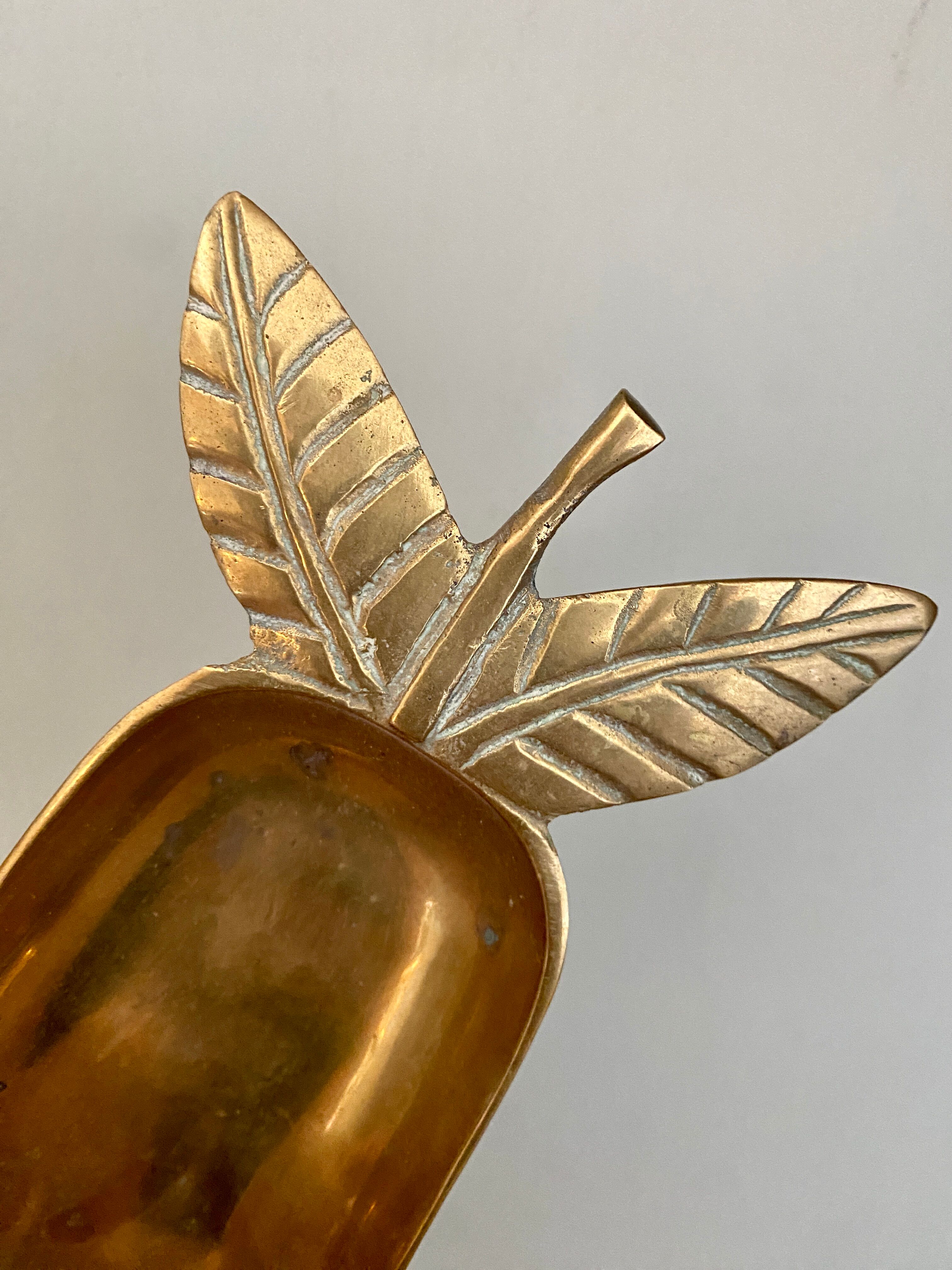 Empty vintage pear-shaped brass pocket