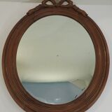 Antique oval mirror in carved wood – Louis XVI style, ribbon bow decoration, mid