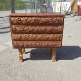 Compact 4-drawer ethnic chest of drawers carved with scenes of African life