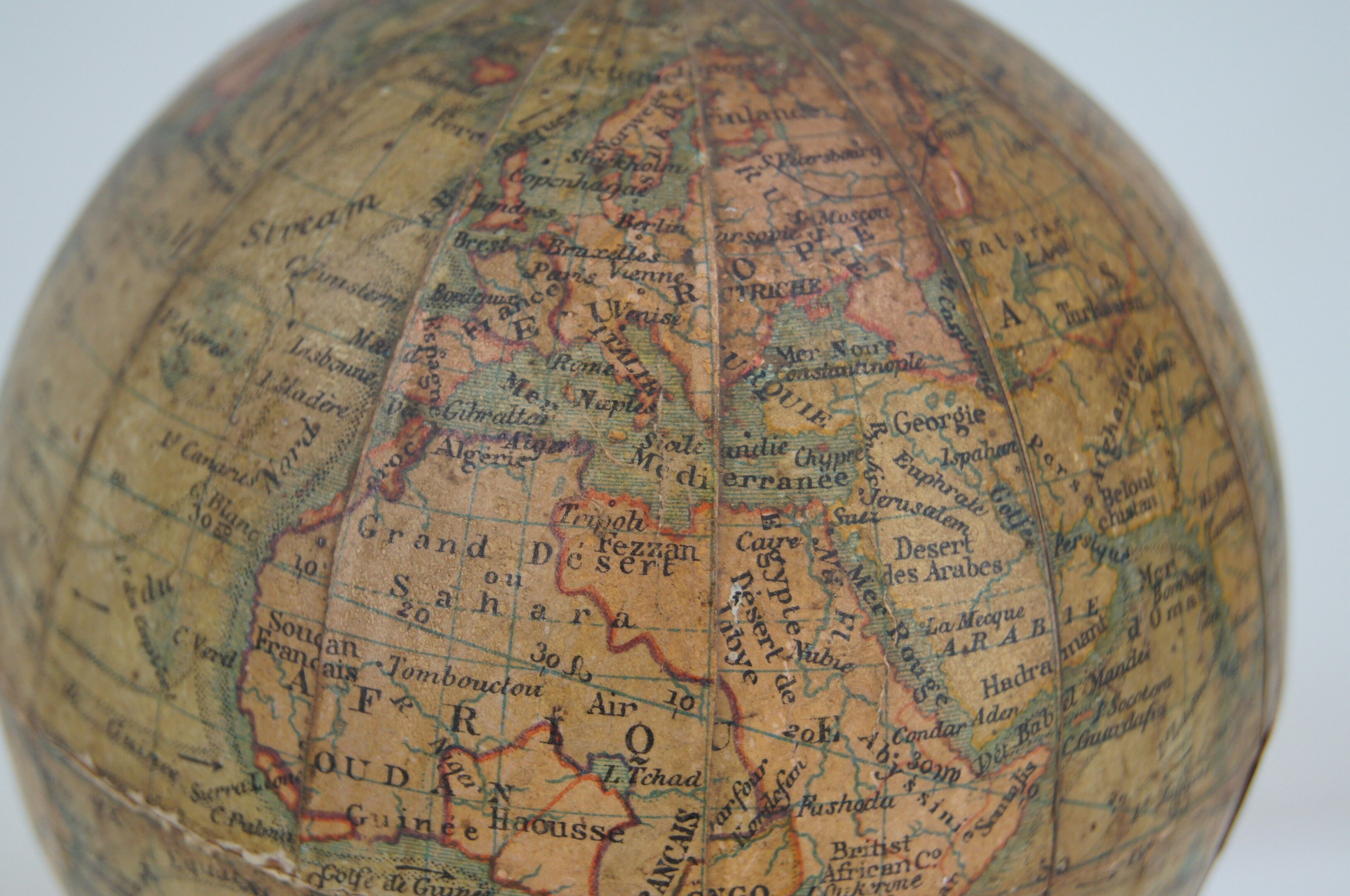 Globe on turned and blackened wooden base