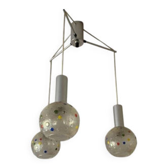 Vintage multicoloured glass sphere ceiling light with red dots and metal structure.