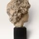 Plaster bust on a wooden base