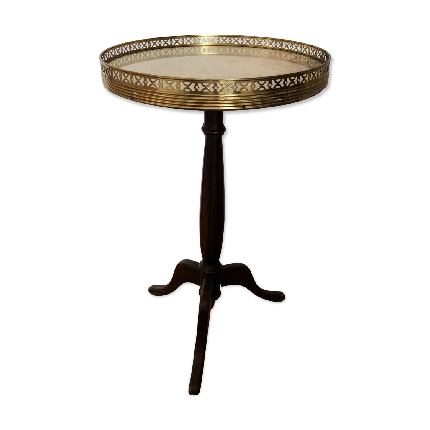 Wooden pedestal table on marble
