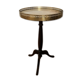 Wooden pedestal table on marble