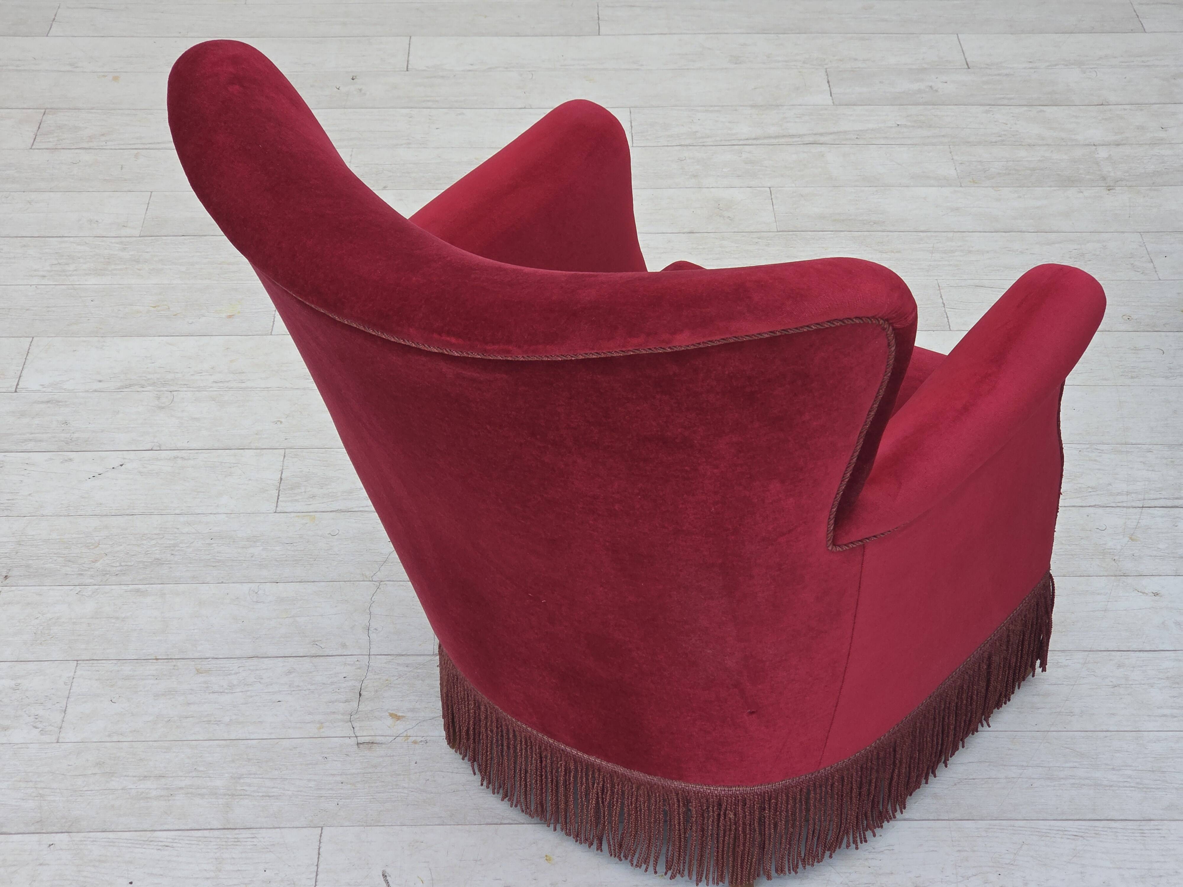 1970s, Danish armchair, cherry-red furniture velour, oak wood legs.