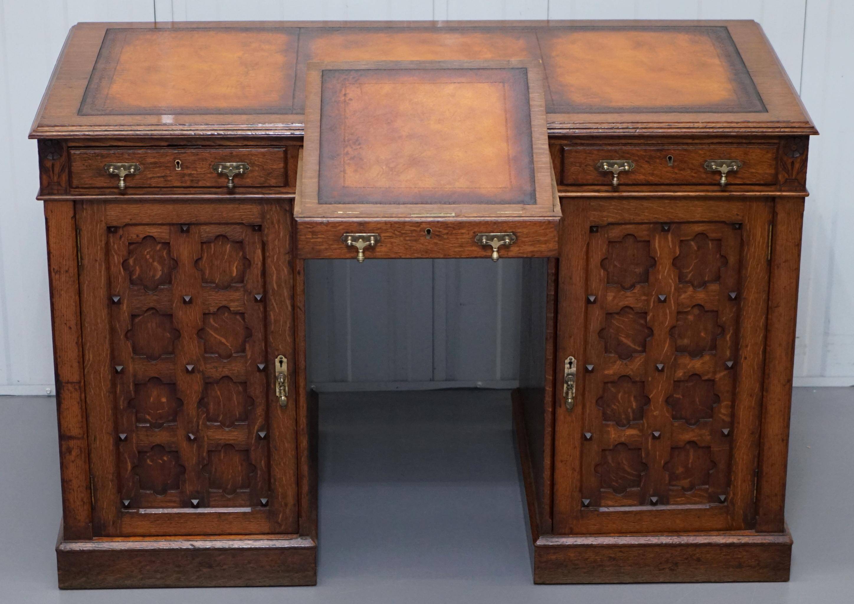 Restored Gothic desk with side bookshelves, drawer, and sloping top by Pugin Gillows.