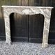 Louis XV fireplace in grey Ardennes marble, a floral basket in white marble, late 18th century.